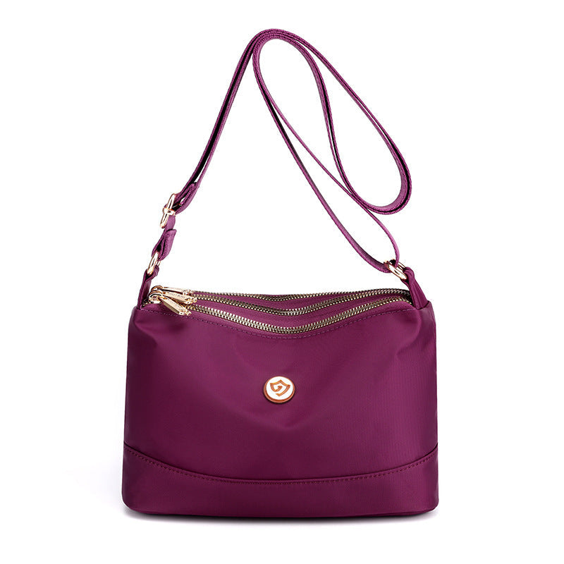 Minimalistisk, romslig skulder- og crossbody-veske i nylon