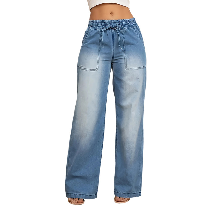 Damebukser med snøring i livet og vide ben i denim