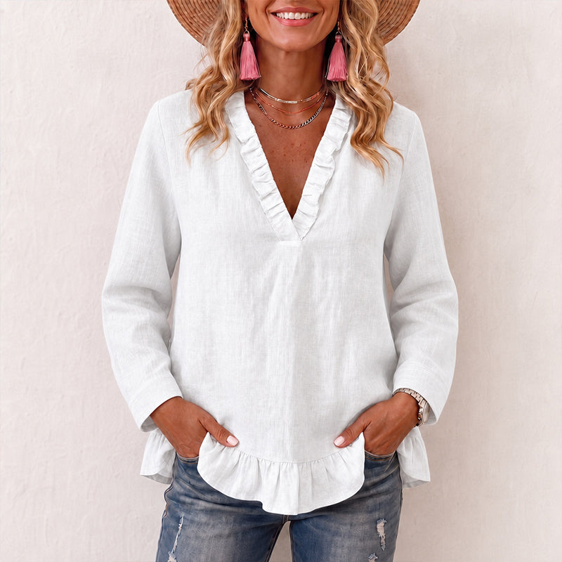 Damebluse med volanger og V-hals