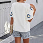 Elegant, brodert blomsterbluse med V-hals for kvinner
