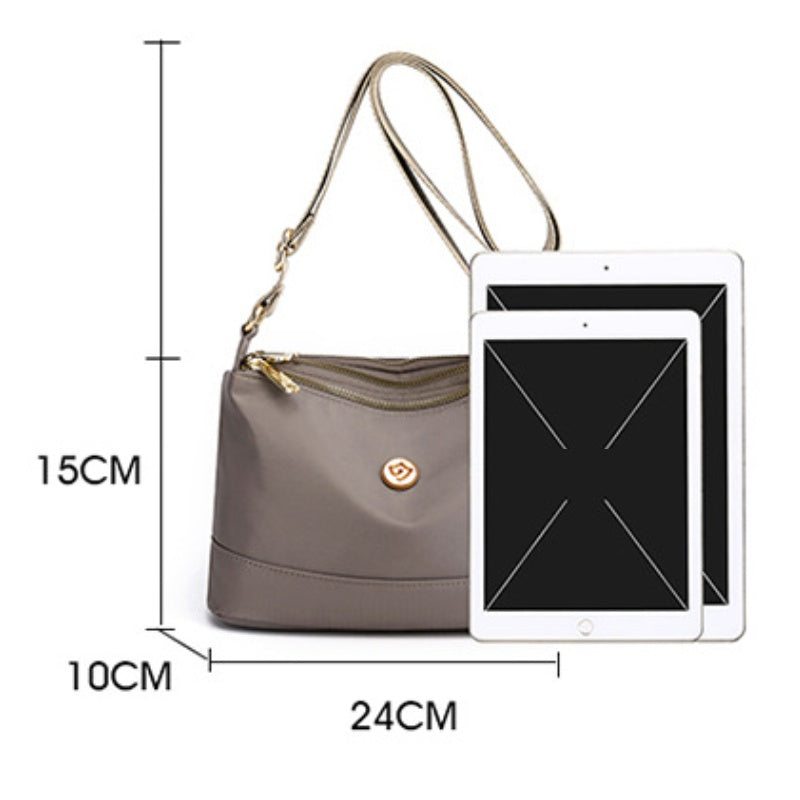 Minimalistisk, romslig skulder- og crossbody-veske i nylon