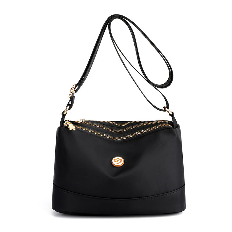 Minimalistisk, romslig skulder- og crossbody-veske i nylon