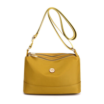 Minimalistisk, romslig skulder- og crossbody-veske i nylon