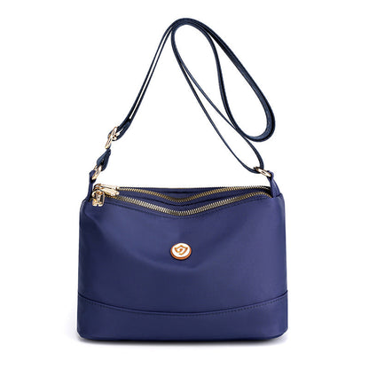 Minimalistisk, romslig skulder- og crossbody-veske i nylon