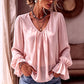 Elegant ensfarget bluse med V-hals for damer