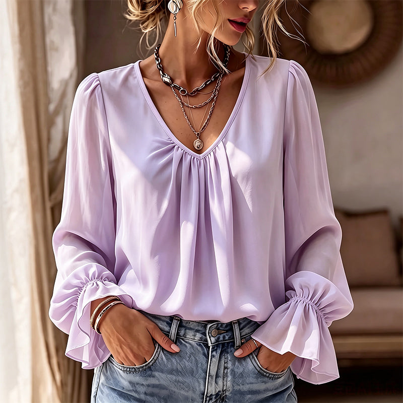 Elegant ensfarget bluse med V-hals for damer