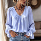 Elegant ensfarget bluse med V-hals for damer