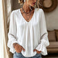 Elegant ensfarget bluse med V-hals for damer