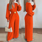 Elegant jumpsuit med V-hals og vide ben, med belte