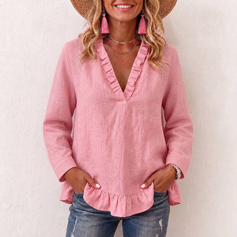 Damebluse med volanger og V-hals