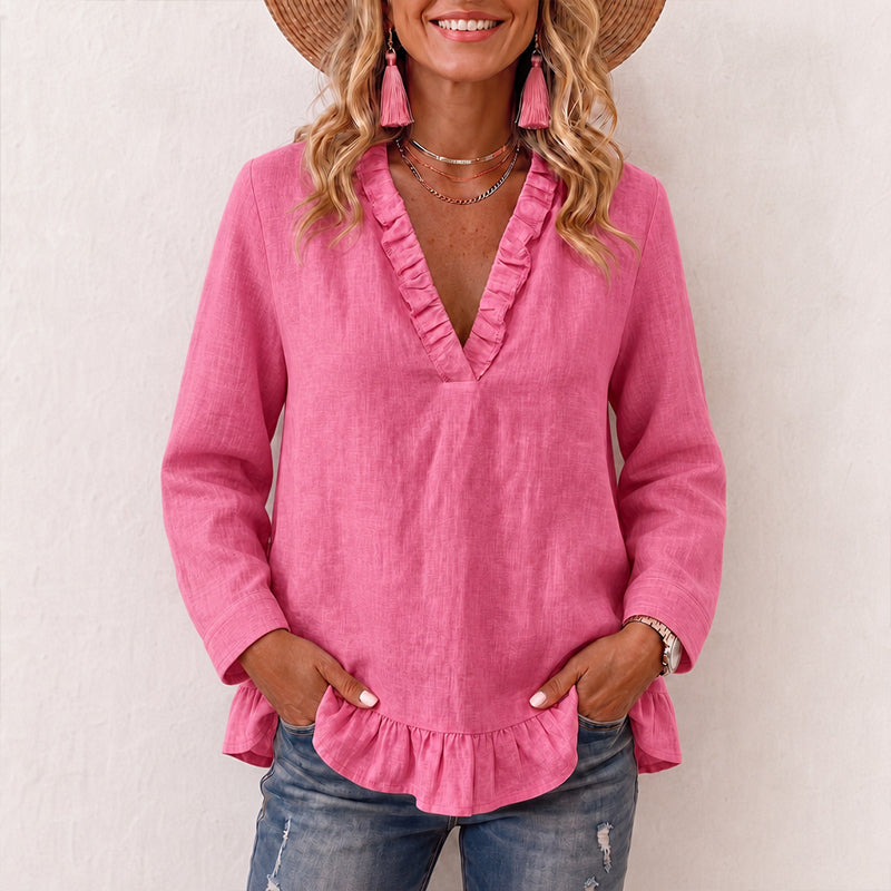 Damebluse med volanger og V-hals