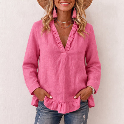 Damebluse med volanger og V-hals