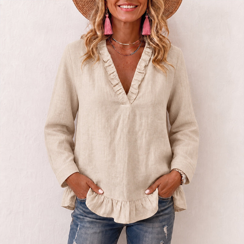 Damebluse med volanger og V-hals