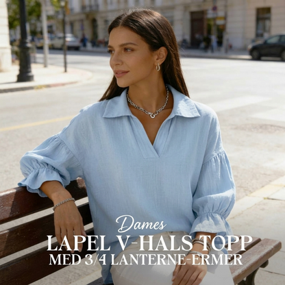 Damebluse med jakkeslag-V-hals og 3/4 lyktermer