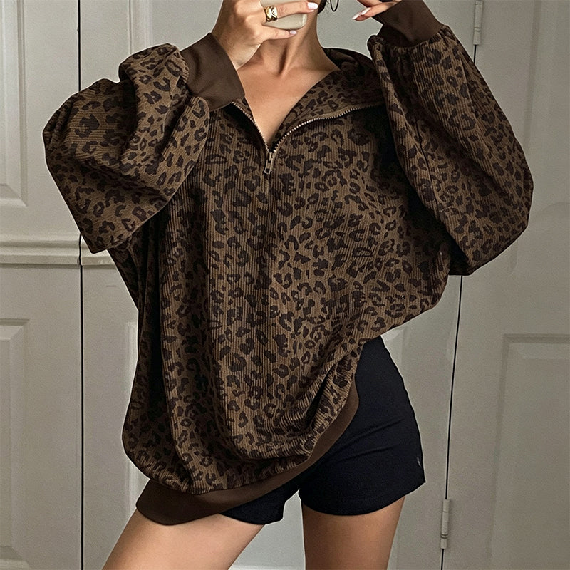 Damegenser med leopardmønstring og kvart glidelås