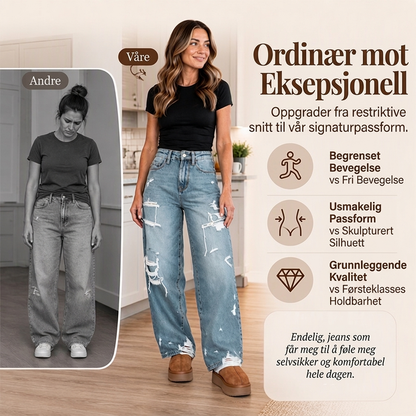 Elegant kvinner i slitne denim-bukser med vide ben